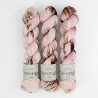 Sysleriget hand dyed yarn in single ply merino wool in the color Cherry Blossom.