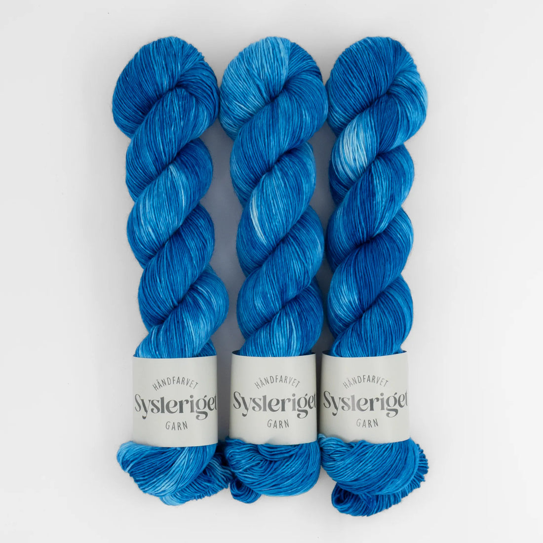 Sysleriget hand dyed yarn in single ply merino wool in the color September Blue.