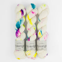 Sysleriget hand dyed yarn in single ply merino wool in the color Unicorn Party.