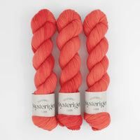 Sysleriget hand dyed yarn in single ply merino wool in the color Wild Poppy.